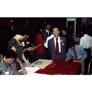 Welcome table for the Chinese Progressive Association's 15th Anniversary Celebration