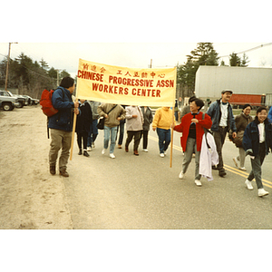 Members of the Chinese Progressive Association Workers' Center march in the International Paper Company strike