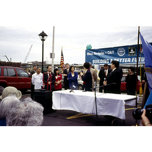 Speaker addresses assembled protestors at their victory ceremony