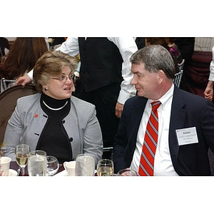 Daniel Condon and a woman converse at The National Council Dinner