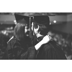 Two graduates hug at Law School commencement