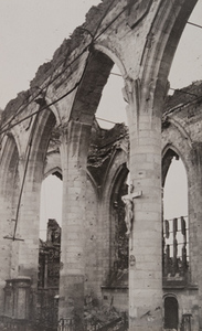 Close-up view of the remnants of a gothic arch from a destroyed stone building, Ypres, 1919