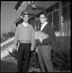 Greg Landry (quarterback, left) and Jim Mitchell (tackle), UMass Amherst football co-captains for 1967-1968, outside Boyden Gymnasium