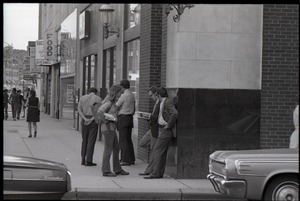 Free Spirit Press crew hawking their magazine to businessmen on the streets