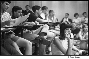 National Student Association Congress: woman with cigarette among other delegates listening to a talk