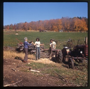 Nina Keller, mother, et al. splitting wood, Montague Farm Commune