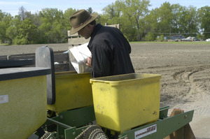 Lazy Acres Farm (Zuchowski Farm): Allan Zuchowski loading seed into a corn planter