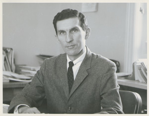 William Deminoff sitting indoors, at desk