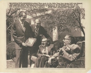 Richard M. Nixon, accompanied by Harold Russell, presents the 1970 President's Trophy to Richard and Robert Santin