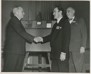 President Harry S. Truman shaking hands with Mr. Yofan