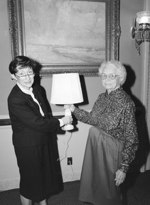 Two women with a table lamp in Congressman John W. Olver's office