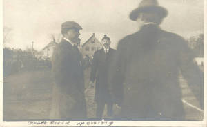 Men standing on Pratt Field during opening ceremony (1910)
