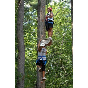 Nadia Alvarez and Ana Hidalgo climb at the Torch Scholars Project Adventure Ropes Course