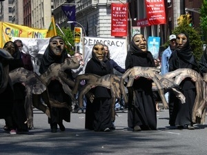Bread and Puppet Theater puppets, marching in the streets to oppose the war in Iraq