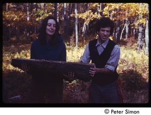 Verandah Porche and Peter Gould lifting a cut log, Tree Frog Farm Commune