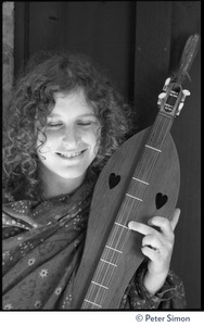 Usha (Cathy Brown): half-length portrait posed with a dulcimer