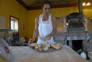 Hungry Ghost Bread: owner and baker Jonathan C. Stevens with fresh-baked bread