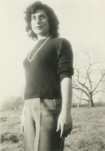 Helen Thomas posing outside