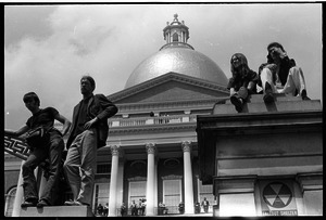 Demonstration at State House against the killings at Kent State: protesters seated on State House steps, capitol dome in background