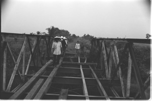 Villagers on their way to the bridge burned by Vietcong, Luong Hoa Village.