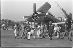 Airport ceremonies for Vietnamese flyers who participated in Dong Hoi raid; Saigon.