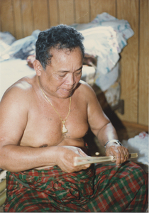 Basket Making: Em Yung works his knife down the length of the split, 1987