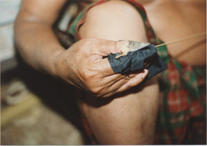 Basket Making: Em Yung keeps his knife very sharp, 1987