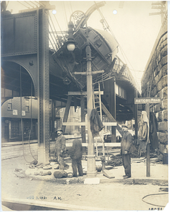 Forest Hills wreck, view from street of car hanging from tracks