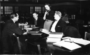 Suffolk University students studying in library