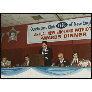 Robert F. Doherty, president of the 1776 Quarterback Club of New England, speaks from the podium at the Club's Annual New England Patriots Awards Dinner