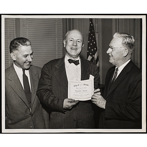 An unidentified man poses with and Executive Director of Boys' Clubs of Boston Arthur T. Burger (center) and Mayor John B. Hynes (right) for Salute to Youth Week