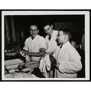 Members of the Tom Pappas Chefs' Club wash dishes