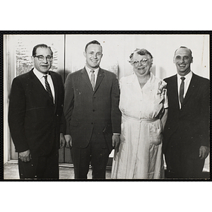 Director of Dining Halls and Chefs' Club Committee member Norman R. Grimm (left), an unidentified man (second from left), Chefs' Club Committee Mary A. Sciacca (second from right) and Boys' Club of Boston Associate Executive Director Louis Zeramby (left) pose for a group shot at Brandeis University