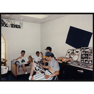 Four teenage boys sit together at an End of Year Party