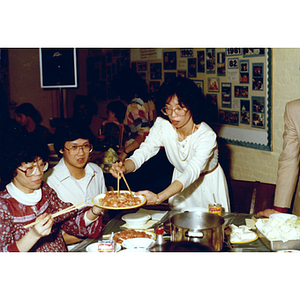 Guests and food at a Chinese Progressive Association party