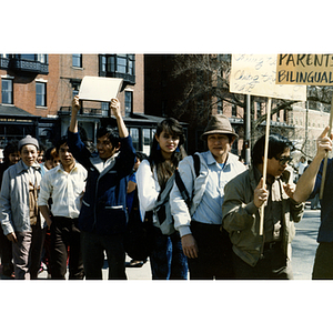 Demonstrators stand on Beacon Street by the Massachusetts State House protesting for bilingual education in schools