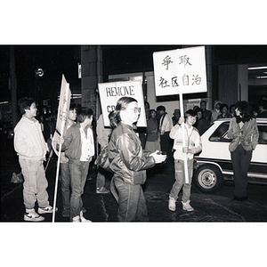 Chinatown residents and concerned citizens participate in a demonstration against the infamous Combat Zone, the red-light district in Boston