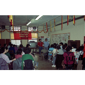 Speaker and guests at an International Women's Day event