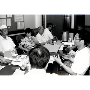 CPA members talking at a Workers' Center meeting