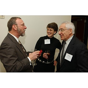 Gerald J. Betro converses with two others at The National Council Dinner