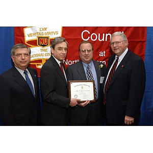 New inductee Joseph Golemme poses with his certificate and others at The National Council Dinner