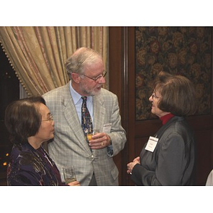 Dr. William Hancock speaks with Trudy Karger, on right, at the gala dinner for John Hatsopoulos