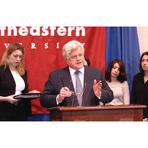 U.S. Senator Edward Kennedy (D-MA) at the podium during a press conference on student aid with his glasses in his hand