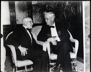 F. Opper and Arthur Brisbane in conversation, seated