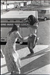 Hollywood Speedway Rock Festival: long-haired man and woman dancing on edge of stage during rock concert