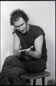 Studio portrait of Richard Safft, seated on a stool