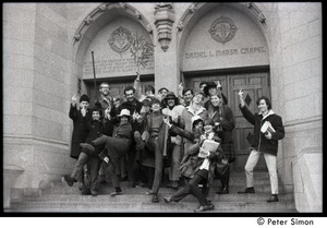 Boston University News staff in doorway of Marsh Chapel, flipping the bird: Peter Simon (center) with Ed Siegel (far right), Sue Katz (second from right), Clif Garboden, Joe Pilati, and Stephen Davis (right, above Simon), and others