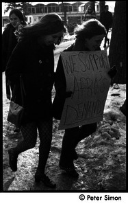 Women walking to protest, carrying sign: 'We support Afro's demands': white student support for Brandeis University African American student protest