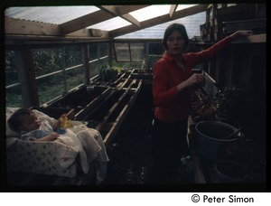 Catherine Blinder and baby in green house, Tree Frog Farm commune