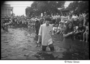 Stephen Davis wading in a Mall reflecting pool during the Poor People's Campaign Solidarity Day